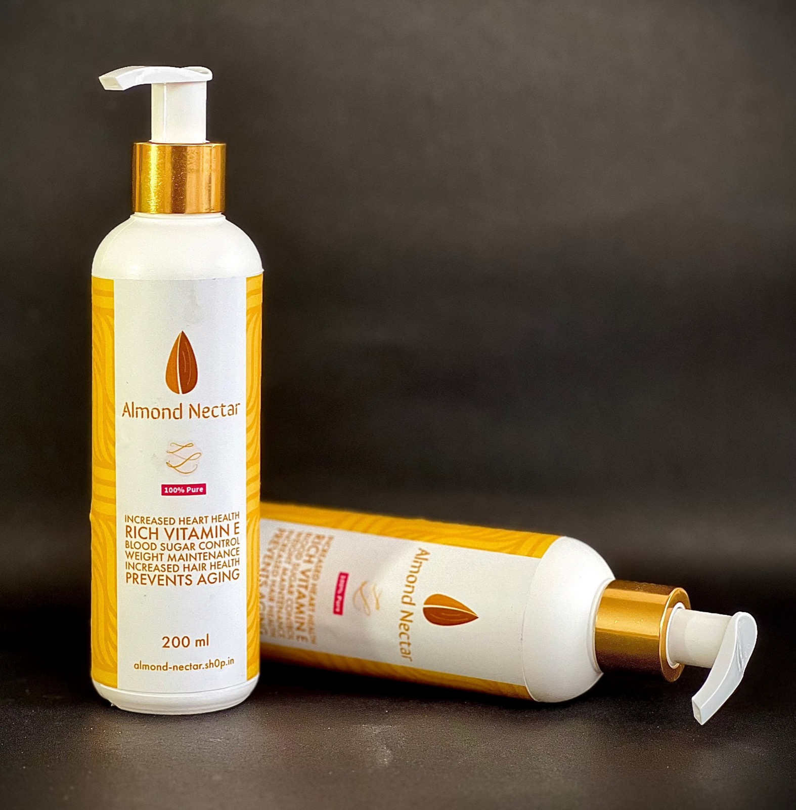 Wood Pressed Sweet Almond Oil, 200ml: white pump bottle with a gold collar and a yellow-patterned label